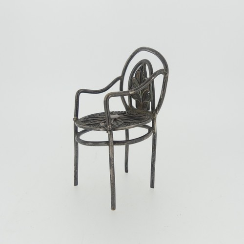 310 - A set of three Continental silver Chairs, with London hallmarks for 1903, 5cm high, together with a ... 