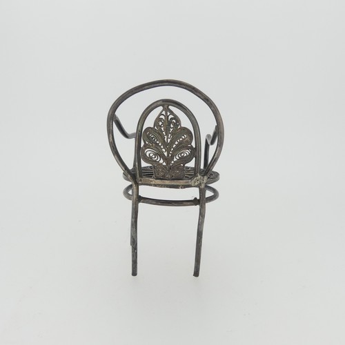 310 - A set of three Continental silver Chairs, with London hallmarks for 1903, 5cm high, together with a ... 