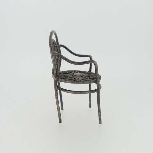 310 - A set of three Continental silver Chairs, with London hallmarks for 1903, 5cm high, together with a ... 