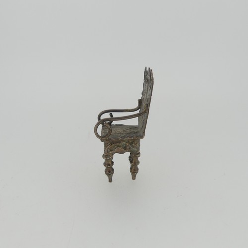 310 - A set of three Continental silver Chairs, with London hallmarks for 1903, 5cm high, together with a ... 