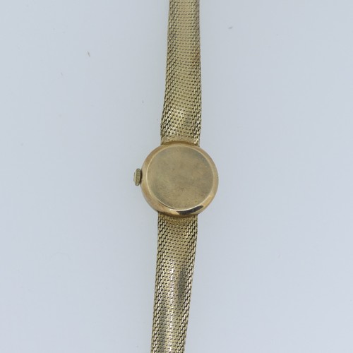 194 - An Omega 9ct gold lady's dress Wristwatch, the circular dial with gilt baton markers, on 9ct gold fl... 