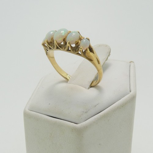 31 - A graduated five stone opal Ring, the centre stone approx. 5.9mm x 4.4mm, all mounted in 18ct yellow... 