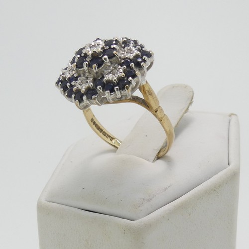 35 - A sapphire and diamond cluster Ring, the cluster 17.5mm wide, all mounted in 9ct yellow and white go... 