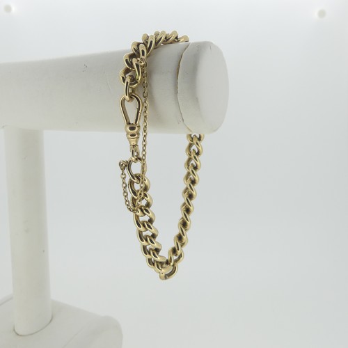 97 - A 9ct yellow gold curb link Bracelet, with watch chain clip fastening, 17cm long, approx total weigh... 