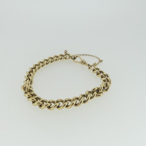 97 - A 9ct yellow gold curb link Bracelet, with watch chain clip fastening, 17cm long, approx total weigh... 