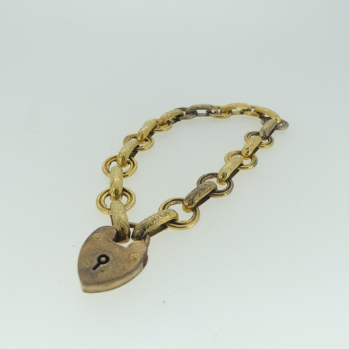 100 - An attractive gold bracelet, formed of a part chain of alternate circular and engraved oval links, 2... 