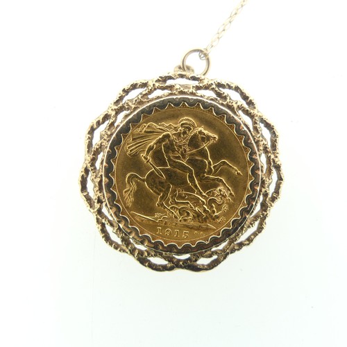 235 - A George V gold Sovereign, dated 1915, in 9ct gold pierced textured pendant mount on 9ct gold fine t... 