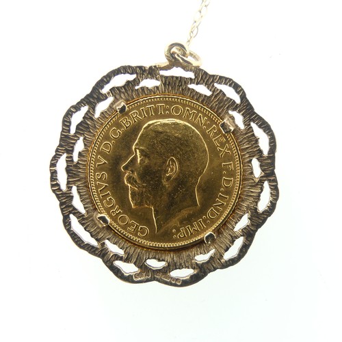 235 - A George V gold Sovereign, dated 1915, in 9ct gold pierced textured pendant mount on 9ct gold fine t... 