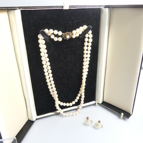 73 - A double row of uniform Cultured Pearls, with 9ct gold garnet cluster snap, 41cm long, together with... 