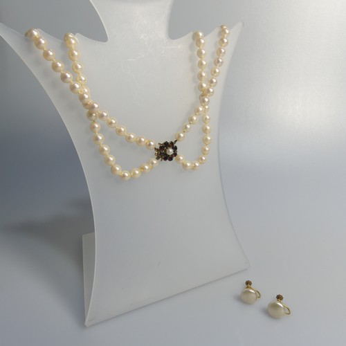 73 - A double row of uniform Cultured Pearls, with 9ct gold garnet cluster snap, 41cm long, together with... 