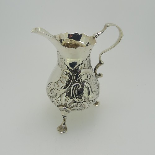 341 - A George II silver Cream Jug, by Samuel Meriton I, hallmarked London, 1746, of traditional form with... 