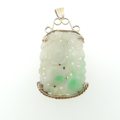 75 - A pierced jade Pendant, in unmarked yellow metal mount, tests as 9ct gold, the jade approx. 5cm x 3.... 