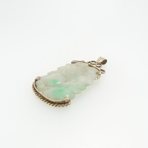 75 - A pierced jade Pendant, in unmarked yellow metal mount, tests as 9ct gold, the jade approx. 5cm x 3.... 