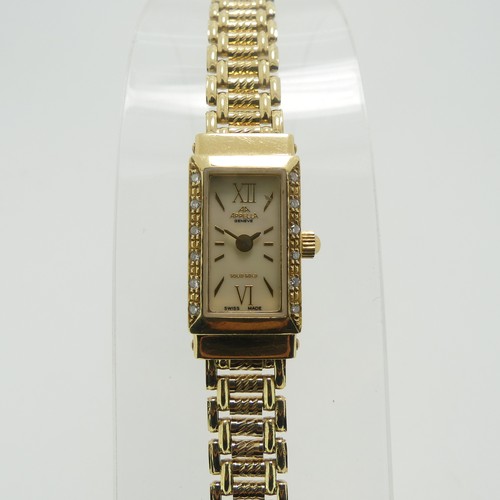 202 - An 18ct yellow gold lady's Appella Wristwatch, ref. 852, with rectangular mother of pearl dial, gold... 