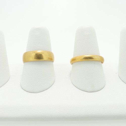 170 - A 22ct yellow gold Band, Size P½, together with another 22ct gold band, distorted, approx Siz... 