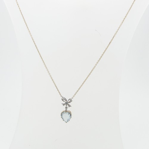 79 - An aquamarine heart Pendant, the stone 10.5mm wide claw set in 9ct yellow gold, suspended from a dia... 