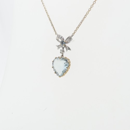 79 - An aquamarine heart Pendant, the stone 10.5mm wide claw set in 9ct yellow gold, suspended from a dia... 