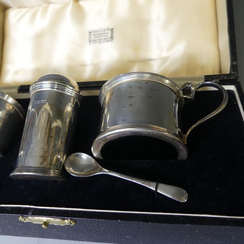 354 - A cased George V silver three piece Cruet Set, by Harrods Ltd., hallmarked London, 1934, of circular... 