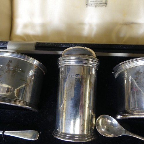 354 - A cased George V silver three piece Cruet Set, by Harrods Ltd., hallmarked London, 1934, of circular... 