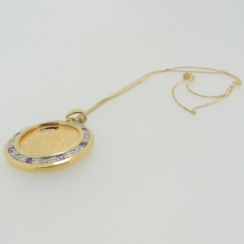 240 - An Elizabeth II gold Half Sovereign, dated 2003, in 9ct gold circular pendant mount set with alterna... 