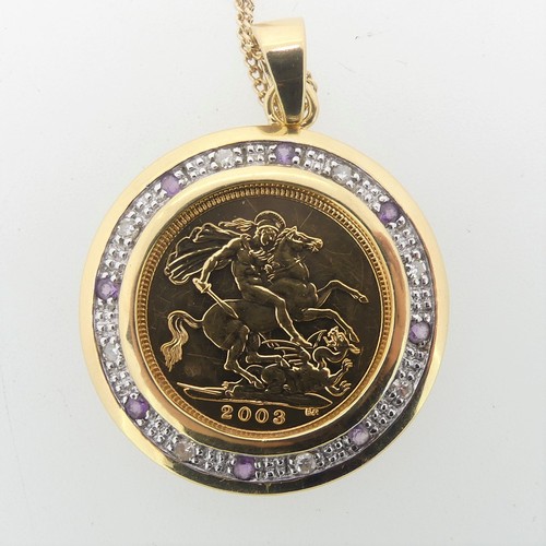 240 - An Elizabeth II gold Half Sovereign, dated 2003, in 9ct gold circular pendant mount set with alterna... 