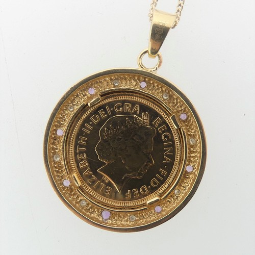 240 - An Elizabeth II gold Half Sovereign, dated 2003, in 9ct gold circular pendant mount set with alterna... 