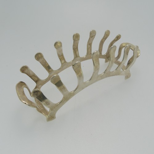 360 - An Edward VIII silver Toast Rack, by Adie Brothers Ltd., hallmarked Birmingham, 1936, of stylised br... 