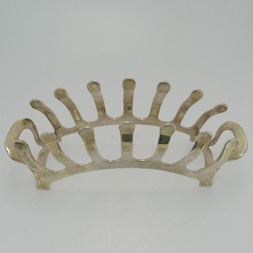 360 - An Edward VIII silver Toast Rack, by Adie Brothers Ltd., hallmarked Birmingham, 1936, of stylised br... 