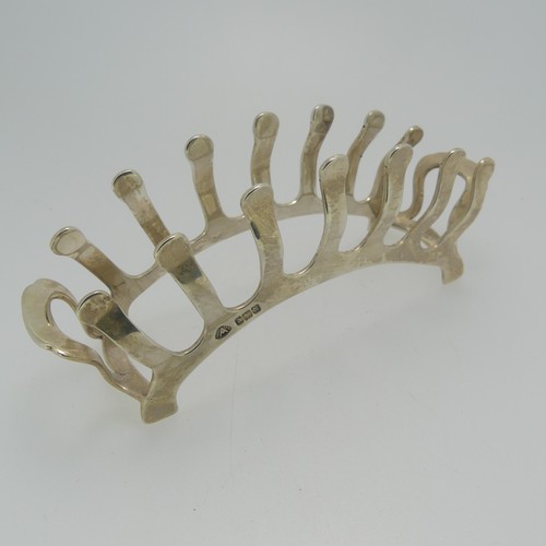 360 - An Edward VIII silver Toast Rack, by Adie Brothers Ltd., hallmarked Birmingham, 1936, of stylised br... 