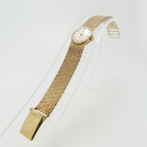 207 - A 9ct yellow gold Record deLuxe lady's Wristwatch, with 17-jewels movement, gold hands and baton mar... 