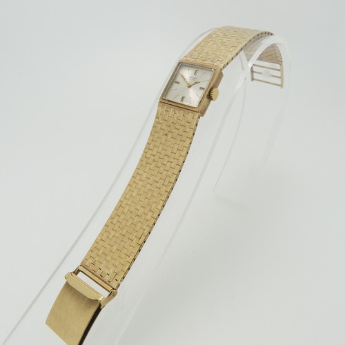 208 - A 9ct yellow gold Record DeLuxe lady's Wristwatch, the square silvered dial with Swiss 17-jewels mov... 