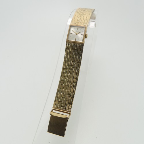 208 - A 9ct yellow gold Record DeLuxe lady's Wristwatch, the square silvered dial with Swiss 17-jewels mov... 