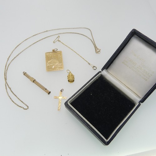 182 - A 9ct yellow gold retractable toothpick, 4.6cm long closed, together with a 9ct gold cross pendant a... 