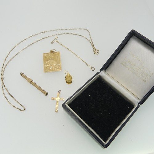 182 - A 9ct yellow gold retractable toothpick, 4.6cm long closed, together with a 9ct gold cross pendant a... 