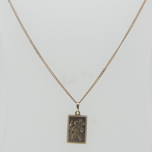 87 - A 9ct gold St. Christopher Pendant, 2cm long, on a fine 9ct gold curb link chain, 50cm long, total w... 