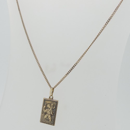 87 - A 9ct gold St. Christopher Pendant, 2cm long, on a fine 9ct gold curb link chain, 50cm long, total w... 