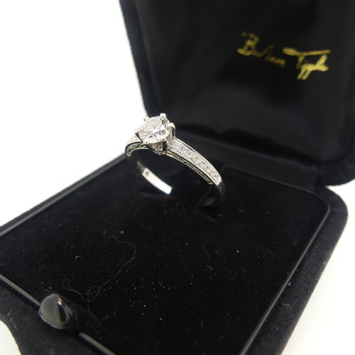 9 - A diamond Solitaire Ring, the brilliant cut stone approx. 0.51ct, six claw set in platinum with eigh... 