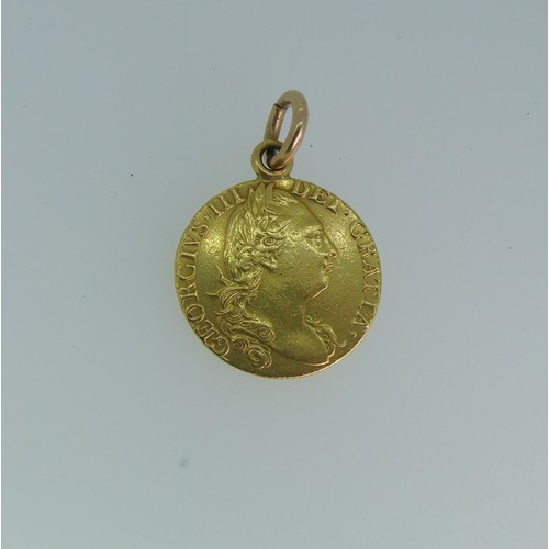 229 - A George III gold Guinea, dated 1782, fourth head, with soldered suspension ring.