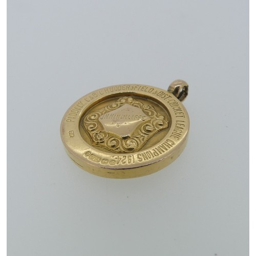 231 - A 9ct gold prize Fob Medallion, with presentation inscription 'Paddock C&B.C Huddersfield & ... 