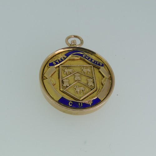 232 - A 9ct gold prize Fob Medallion, the front enamelled 'Sykes Charity Cup', the reverse with presentati... 