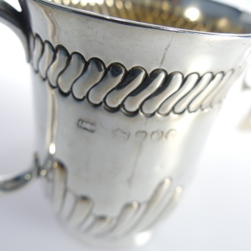 339 - A Victorian silver Christening Mug, by George Unite & Sons, hallmarked London, 1889, with fluted... 