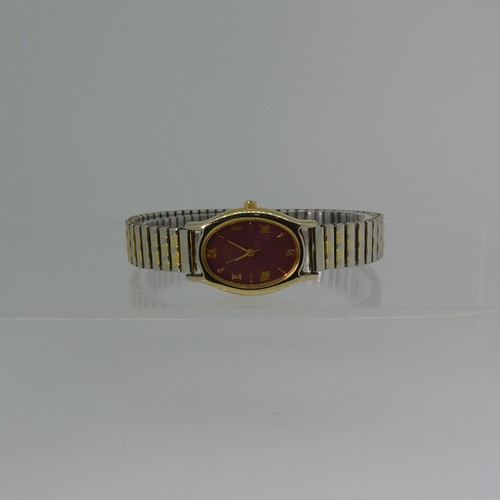 184 - Two 9ct gold rings set garnets, together with a silver tank cased wristwatch by Avantino with leathe... 