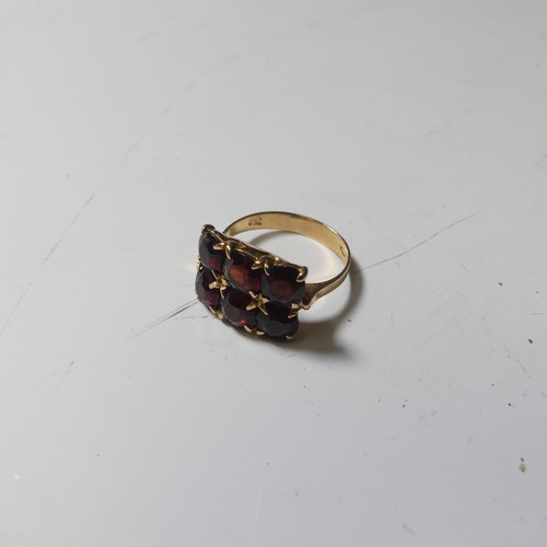 184 - Two 9ct gold rings set garnets, together with a silver tank cased wristwatch by Avantino with leathe... 