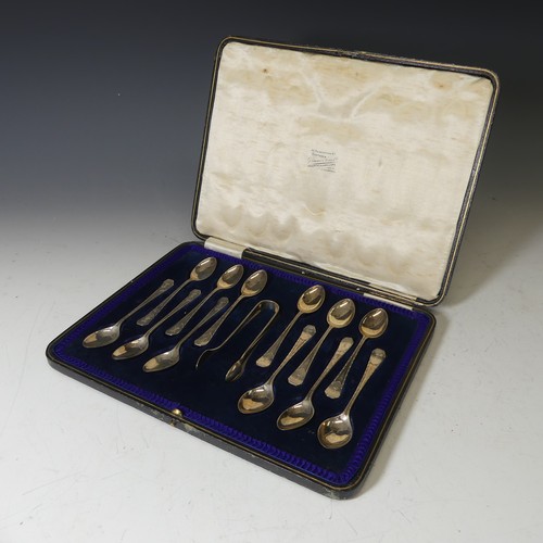 335 - A cased set of twelve George V silver Teaspoons with Sugar Nips, by Lee & Wigfull, hallmarked Sh... 