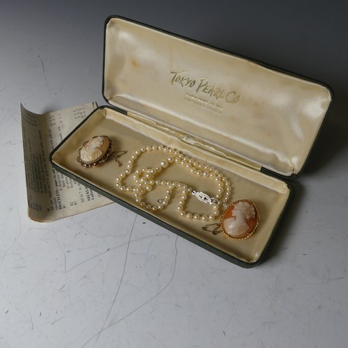 170A - Two 9ct gold mounted oval shell Cameo's, together with a string of graduated cultured pearls (3)... 