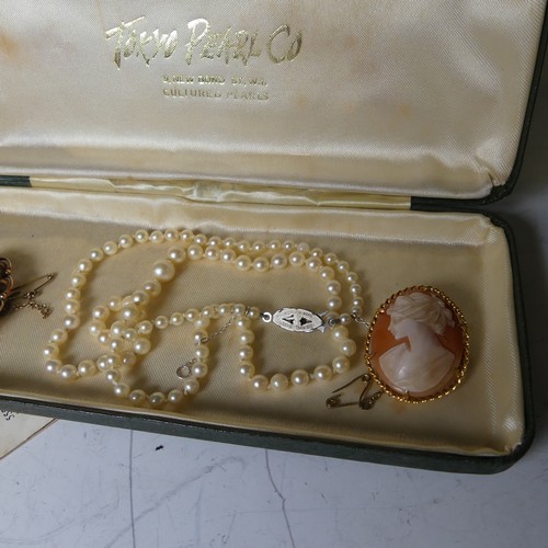 170A - Two 9ct gold mounted oval shell Cameo's, together with a string of graduated cultured pearls (3)... 