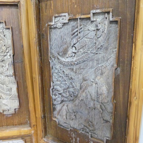 256 - A set of three carved classical Chinese Screens/Window Shutters, one side with detailed carvings of ... 