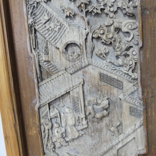 256 - A set of three carved classical Chinese Screens/Window Shutters, one side with detailed carvings of ... 