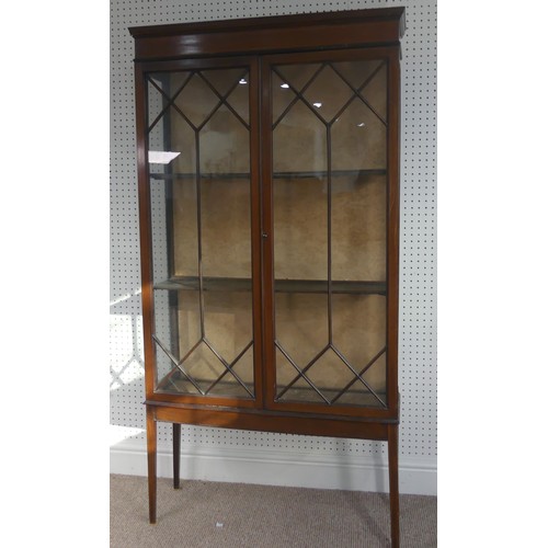 258 - An Edwardian mahogany display cabinet, with inlaid decoration, having three shelves enclosed by two ... 