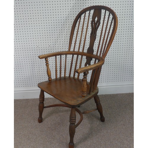 259 - A Late Victorian ash and elm Windsor Chair, stick-back with pierced splat above solid carved base up... 